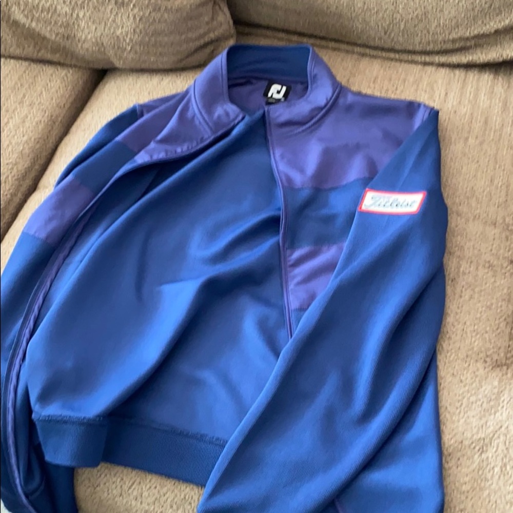 Blue footjoy zip up with titelist patch